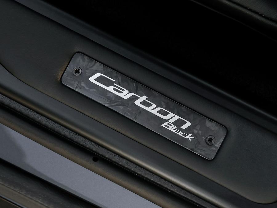 Логотип Aston Martin DB9 Carbon Black 2014 года  (UK) (фото 14 из 19)